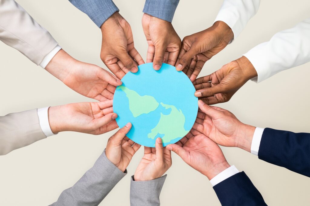 Hands holding earth CSR business campaign